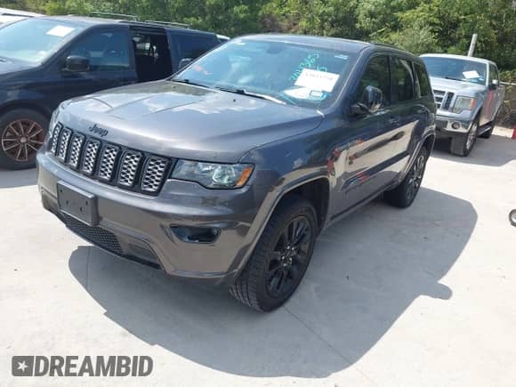 2018 Jeep Grand Cherokee Laredo E with VIN 1C4RJEAG6JC304365, listed as a IAAI auction lot 43023758 with 140,626 mi miles and . Bid and sale history available at DreamBid. Image 17.