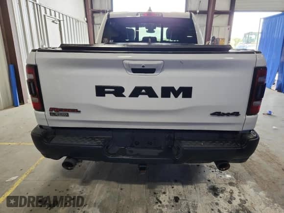 2020 Ram 1500 Rebel z VIN 1C6SRFLT4LN314434, wystawiony jako Copart lot #71672725 z przebiegiem 74 848 mil mil oraz Czysty tytuł • Clean title. Historia ofert i sprzedaży dostępna na DreamBid. Obrazek 6.