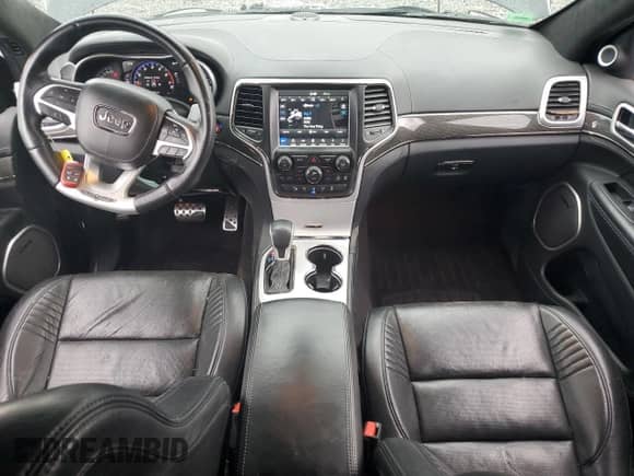 2018 Jeep Grand Cherokee Trackhawk with VIN 1C4RJFN90JC397921, listed as a Copart auction lot 68282005 with 70,720 mi miles and Salvage title. Bid and sale history available at DreamBid. Image 8.