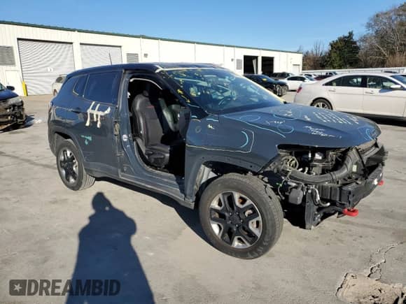 2017 Jeep Compass Trailhawk with VIN 3C4NJDDB3HT656830, listed as a Copart auction lot 86705404 with 50,753 mi miles and Salvage title. Bid and sale history available at DreamBid. Image 4.