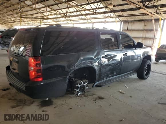 2013 Chevrolet Suburban LT with VIN 1GNSKJE74DR229904, listed as a Copart auction lot 65077365 with 167,582 mi miles and Salvage title. Bid and sale history available at DreamBid. Image 3.