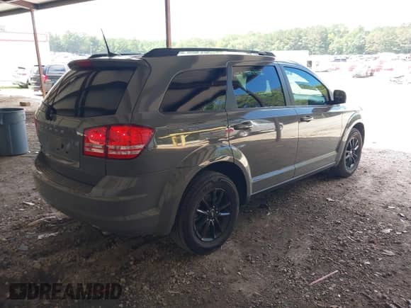2020 Dodge Journey SE Value with VIN 3C4PDCABXLT259669, listed as a IAAI auction lot 42995598 with 98,957 mi miles and . Bid and sale history available at DreamBid. Image 4.
