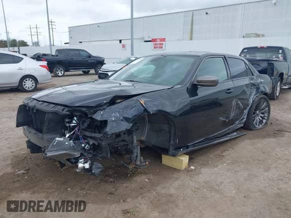 2013 Chrysler 300 C John Varvatos Limited Edition with VIN 2C3CCADG2DH698344, listed as a IAAI auction lot 41480379 with 166,423 mi miles and . Bid and sale history available at DreamBid. Image 2.