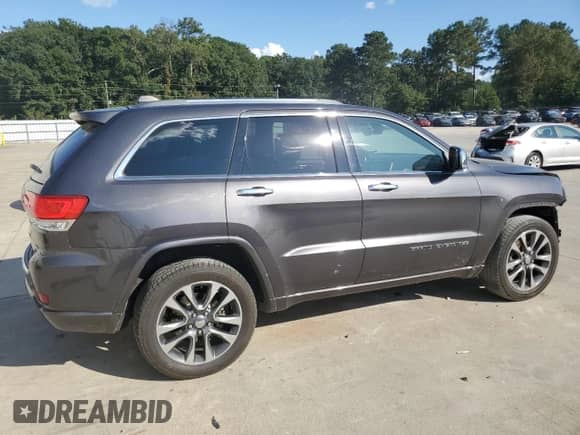 2017 Jeep Grand Cherokee Overland with VIN 1C4RJECGXHC916964, listed as a Copart auction lot 80358275 with 169,868 mi miles and Salvage title. Bid and sale history available at DreamBid. Image 3.