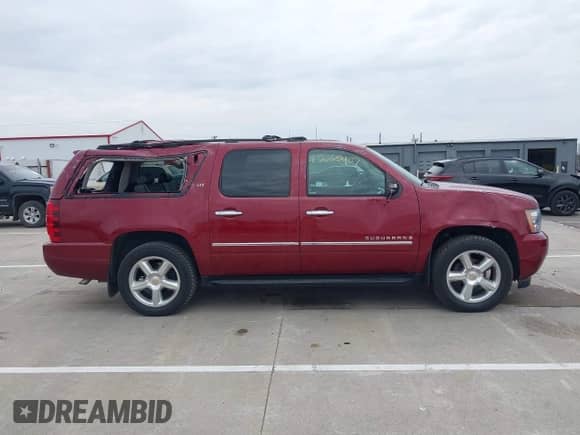 2009 Chevrolet Suburban LTZ z VIN 1GNFK36309J105434, wystawiony jako IAAI lot #42062907 z przebiegiem 132 674 mil mil oraz . Historia ofert i sprzedaży dostępna na DreamBid. Obrazek 13.