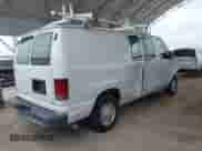 2013 Ford Econoline Cargo Commercial with VIN 1FTNE1EW3DDA23099, listed as a IAAI auction lot 42378723 with 148,512 mi miles and . Bid and sale history available at DreamBid. Image 4.