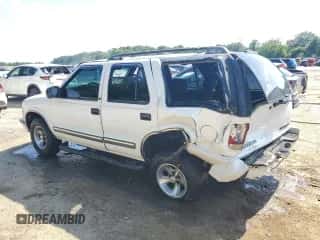 2001 Chevrolet Blazer LS z VIN 1GNCS13W91K262044, wystawiony jako Copart lot #61214774 z przebiegiem Nie podano mil oraz Szkoda całkowita • Salvage title. Historia ofert i sprzedaży dostępna na DreamBid. Obrazek 2.