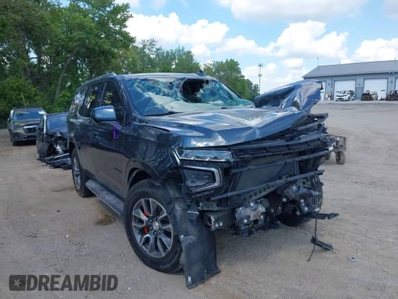 2021 Chevrolet Tahoe LT z VIN 1GNSKNKD7MR422744, wystawiony jako IAAI lot #42629416 z przebiegiem 73 615 mil mil oraz . Historia ofert i sprzedaży dostępna na DreamBid. Obrazek 1.