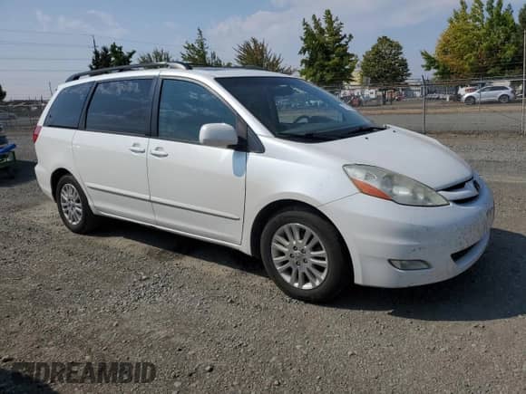 2010 Toyota Sienna XLE с VIN 5TDYK4CC2AS312328, выставлен на аукционе Copart как лот 71203025 с пробегом 182 360 миль миль и Списание • Salvage title. История ставок и продаж доступна на DreamBid. Изображение 4.