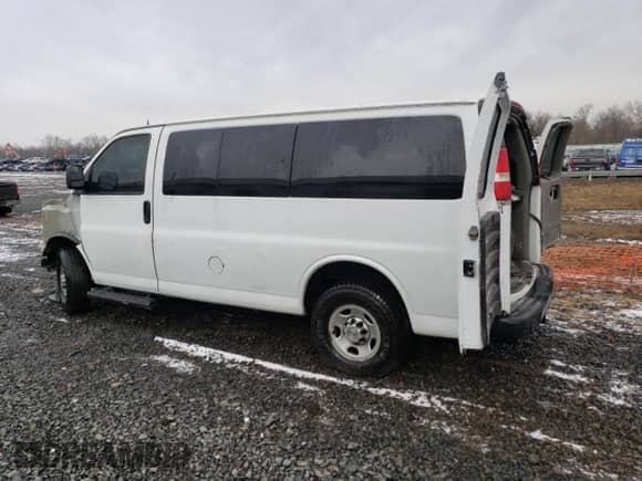 2012 Chevrolet Express Passenger LS with VIN 1GAWGPFG3C1151456, listed as a Copart auction lot 42630525 with 112,674 mi miles and Salvage title. Bid and sale history available at DreamBid. Image 2.