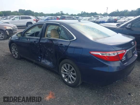 2015 Toyota Camry LE with VIN 4T1BD1FK8FU165173, listed as a IAAI auction lot 42662431 with 297,983 mi miles and . Bid and sale history available at DreamBid. Image 3.