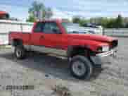 2000 Dodge 2500 with VIN 1B7KF23Z6YJ187490, listed as a Copart auction lot 57873375 with 238,769 mi miles and Salvage title. Bid and sale history available at DreamBid. Image 4.