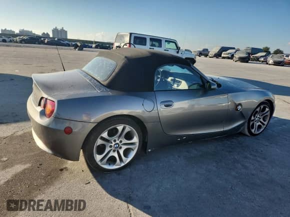 2004 BMW Z4 3.0i with VIN 4USBT53564LT25710, listed as a Copart auction lot 80996885 with 80,517 mi miles and Salvage title. Bid and sale history available at DreamBid. Image 3.