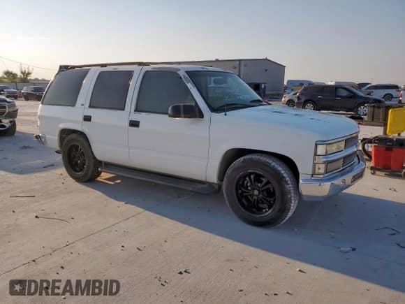 1999 Chevrolet Tahoe с VIN 1GNEC13RXXJ336652, выставлен на аукционе Copart как лот 80550675 с пробегом 261 159 миль миль и Списание • Salvage title. История ставок и продаж доступна на DreamBid. Изображение 4.