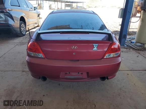 2005 Hyundai Tiburon GT с VIN KMHHN65F05U174909, выставлен на аукционе Copart как лот 66709075 с пробегом 126 466 миль миль и Списание • Salvage title. История ставок и продаж доступна на DreamBid. Изображение 6.