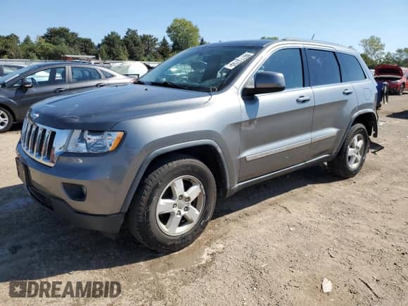 2012 Jeep Grand Cherokee Laredo with VIN 1C4RJFAG2CC135566, listed as a Copart auction lot 80711755 with 163,412 mi miles and Salvage title. Bid and sale history available at DreamBid. Image 1.