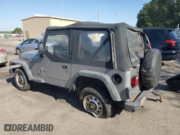 2000 Jeep Wrangler SE with VIN 1J4FA29P4YP775935, listed as a Copart auction lot 80458955 with 100,211 mi miles and Salvage title. Bid and sale history available at DreamBid. Image 2.