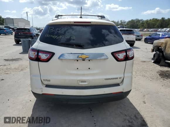 2014 Chevrolet Traverse LT с VIN 1GNKRHKD0EJ331733, выставлен на аукционе Copart как лот 77267894 с пробегом Не указан миль и Списание • Salvage title. История ставок и продаж доступна на DreamBid. Изображение 6.