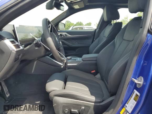 2025 BMW i4 xDrive40 with VIN WBY43HD07SFU58618, listed as a Copart auction lot 66215385 with 3,514 mi miles and Salvage title. Bid and sale history available at DreamBid. Image 7.