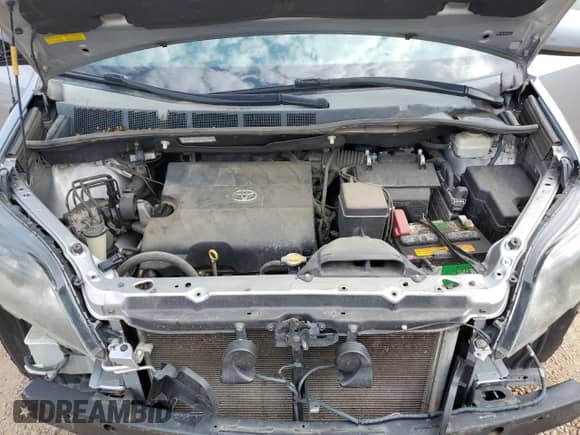 2014 Toyota Sienna SE with VIN 5TDXK3DC0ES412437, listed as a Copart auction lot 70558525 with 145,488 mi miles and Salvage title. Bid and sale history available at DreamBid. Image 12.