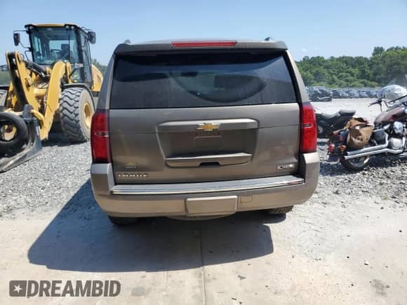 2017 Chevrolet Tahoe Premier with VIN 1GNSCCKC3HR356675, listed as a Copart auction lot 61758905 with 142,657 mi miles and Salvage title. Bid and sale history available at DreamBid. Image 6.