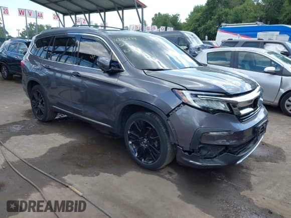 2019 Honda Pilot Touring 8-Passenger z VIN 5FNYF6H9XKB002530, wystawiony jako IAAI lot #43112644 z przebiegiem 122 140 mil mil oraz . Historia ofert i sprzedaży dostępna na DreamBid. Obrazek 1.