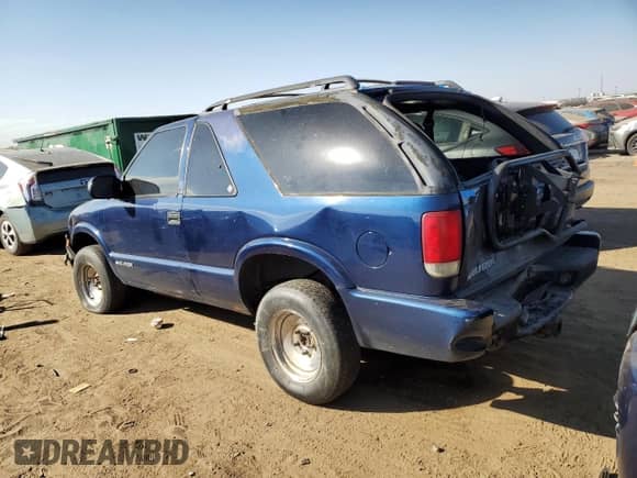 2001 Chevrolet Blazer LS z VIN 1GNCT18W91K189599, wystawiony jako Copart lot #74595674 z przebiegiem 208 309 mil mil oraz Szkoda całkowita • Salvage title. Historia ofert i sprzedaży dostępna na DreamBid. Obrazek 2.