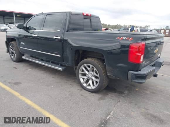 2018 Chevrolet Silverado 1500 High Country z VIN 3GCUKTEJ6JG178894, wystawiony jako IAAI lot #41606265 z przebiegiem 148 068 mil mil oraz . Historia ofert i sprzedaży dostępna na DreamBid. Obrazek 3.