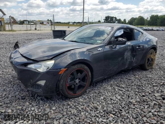 2016 Scion FR-S with VIN JF1ZNAA18G9705694, listed as a Copart auction lot 69179845 with 98,710 mi miles and Salvage title. Bid and sale history available at DreamBid. Image 1.