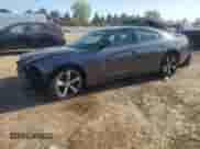 2014 Dodge Charger SXT with VIN 2C3CDXHGXEH232141, listed as a Copart auction lot 84556645 with 167,659 mi miles and Salvage title. Bid and sale history available at DreamBid. Image 1.