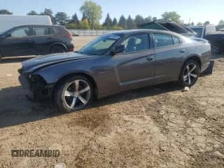 2014 Dodge Charger SXT with VIN 2C3CDXHGXEH232141, listed as a Copart auction lot 84556645 with 167,659 mi miles and Salvage title. Bid and sale history available at DreamBid. Image 1.