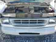 2000 Ford Econoline Cargo z VIN 1FTNE24L1YHB02766, wystawiony jako Copart lot #83772725 z przebiegiem 119 156 mil mil oraz Czysty tytuł • Clean title. Historia ofert i sprzedaży dostępna na DreamBid. Obrazek 12.