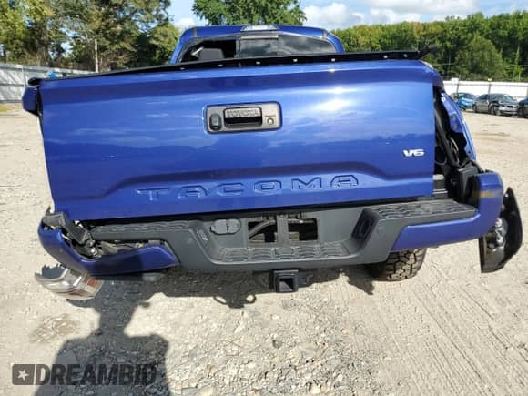 2022 Toyota Tacoma SR5 with VIN 3TYDZ5BN0NT005849, listed as a Copart auction lot 71113125 with 63,449 mi miles and Salvage title. Bid and sale history available at DreamBid. Image 6.