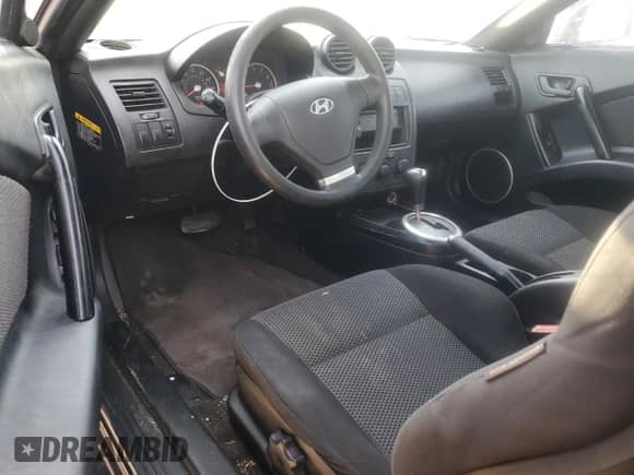 2003 Hyundai Tiburon с VIN KMHHM65D03U095741, выставлен на аукционе Copart как лот 55147305 с пробегом 170 946 миль миль и Списание • Salvage title. История ставок и продаж доступна на DreamBid. Изображение 8.