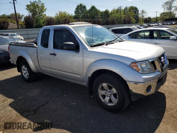 2010 Nissan Frontier SE with VIN 1N6AD0CW3AC441174, listed as a Copart auction lot 71953725 with 121,734 mi miles and Salvage title. Bid and sale history available at DreamBid. Image 4.
