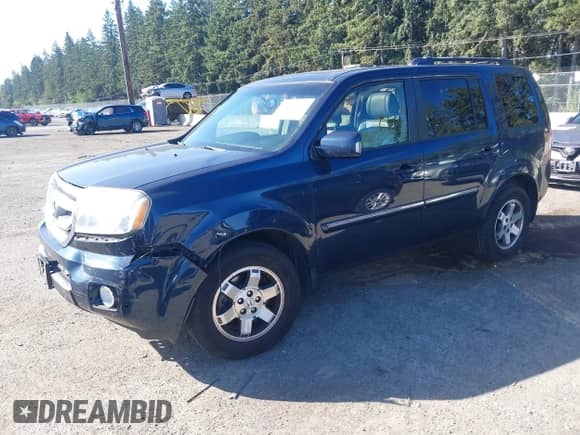 2009 Honda Pilot Touring with VIN 5FNYF489X9B007452, listed as a IAAI auction lot 43262557 with 206,355 mi miles and . Bid and sale history available at DreamBid. Image 2.