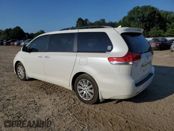 2012 Toyota Sienna XLE AAS with VIN 5TDYK3DC3CS198576, listed as a Copart auction lot 80911565 with 95,740 mi miles and Salvage title. Bid and sale history available at DreamBid. Image 2.
