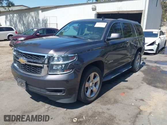 2017 Chevrolet Tahoe LT with VIN 1GNSCBKC2HR132923, listed as a IAAI auction lot 42847378 with 105,804 mi miles and . Bid and sale history available at DreamBid. Image 2.