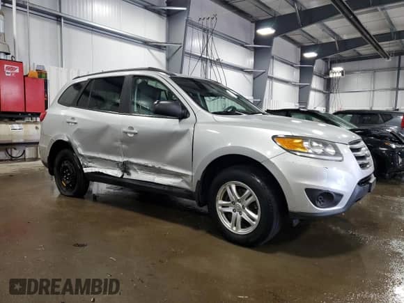 2012 Hyundai Santa Fe GLS z VIN 5XYZGDAB8CG119715, wystawiony jako Copart lot #61458234 z przebiegiem 140 378 mil mil oraz Szkoda całkowita • Salvage title. Historia ofert i sprzedaży dostępna na DreamBid. Obrazek 4.