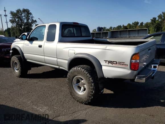 2002 Toyota Tacoma z VIN 5TEWN72NX2Z070220, wystawiony jako Copart lot #81276465 z przebiegiem 143 793 mil mil oraz Szkoda całkowita • Salvage title. Historia ofert i sprzedaży dostępna na DreamBid. Obrazek 2.