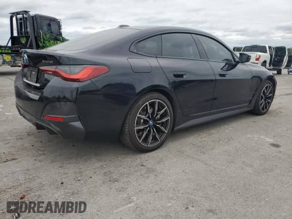 2023 BMW i4 eDrive40 с VIN WBY73AW06PFN95798, выставлен на аукционе Copart как лот 67530055 с пробегом 9 245 миль миль и Списание • Salvage title. История ставок и продаж доступна на DreamBid. Изображение 3.
