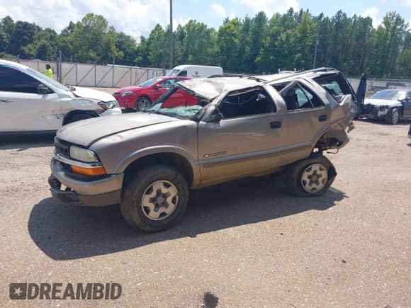 2003 Chevrolet Blazer LS with VIN 1GNDT13X73K101849, listed as a IAAI auction lot 42833790 with 231,538 mi miles and . Bid and sale history available at DreamBid. Image 2.