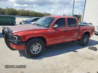 2002 Dodge Dakota Sport z VIN 1B7HL38X52S716509, wystawiony jako Copart lot #47255785 z przebiegiem 167 450 mil mil oraz Nie do naprawy • Non repairable. Historia ofert i sprzedaży dostępna na DreamBid. Obrazek 1.