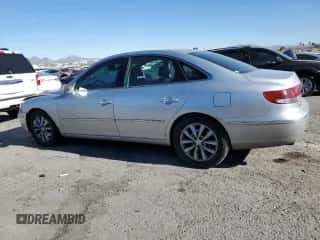 2007 Hyundai Azera SE с VIN KMHFC46F47A234162, выставлен на аукционе Copart как лот 85822104 с пробегом 122 281 миль миль и Списание • Salvage title. История ставок и продаж доступна на DreamBid. Изображение 2.