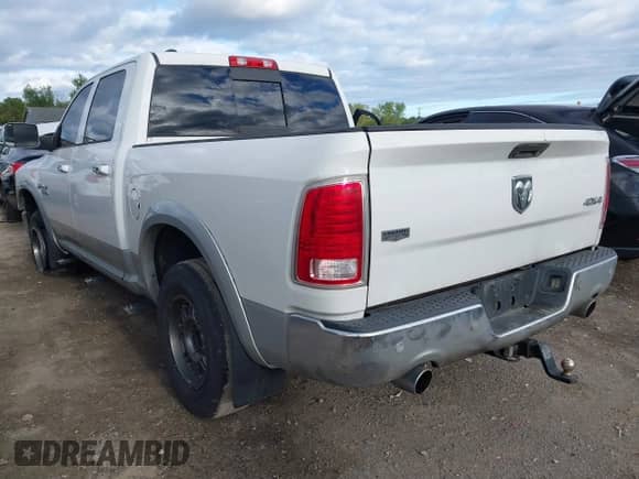 2014 Ram 1500 Laramie with VIN 1C6RR7NT0ES104743, listed as a IAAI auction lot 43091535 with 154,982 mi miles and . Bid and sale history available at DreamBid. Image 3.