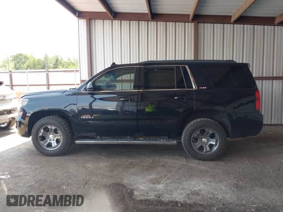 2015 Chevrolet Tahoe LT z VIN 1GNSKBKC2FR593328, wystawiony jako IAAI lot #42919786 z przebiegiem 157 484 mil mil oraz . Historia ofert i sprzedaży dostępna na DreamBid. Obrazek 14.