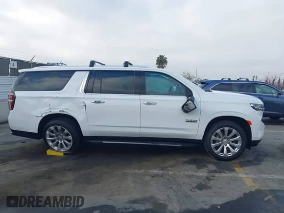 2021 Chevrolet Suburban Premier z VIN 1GNSKFKDXMR185737, wystawiony jako IAAI lot #42087355 z przebiegiem Nie podano mil oraz . Historia ofert i sprzedaży dostępna na DreamBid. Obrazek 13.
