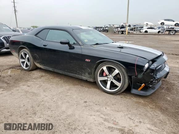 2012 Dodge Challenger SRT-8 392 с VIN 2C3CDYCJ9CH227972, выставлен на аукционе Copart как лот 58953765 с пробегом 69 004 миль миль и Списание • Salvage title. История ставок и продаж доступна на DreamBid. Изображение 4.