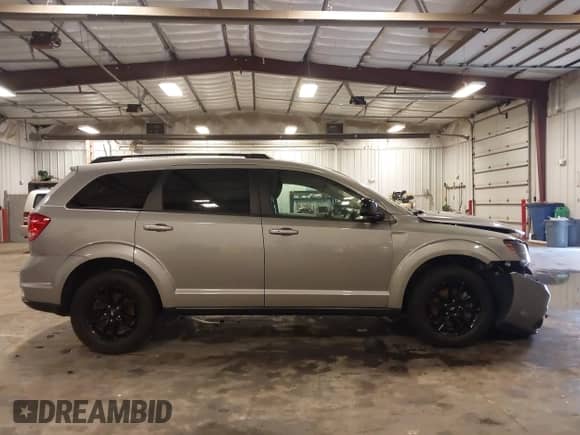 2019 Dodge Journey SE z VIN 3C4PDCBB2KT797019, wystawiony jako IAAI lot #42824621 z przebiegiem 49 411 mil mil oraz . Historia ofert i sprzedaży dostępna na DreamBid. Obrazek 13.