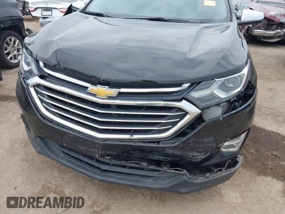 2018 Chevrolet Equinox Premier with VIN 2GNAXMEV8J6116896, listed as a IAAI auction lot 43157123 with 85,679 mi miles and . Bid and sale history available at DreamBid. Image 6.
